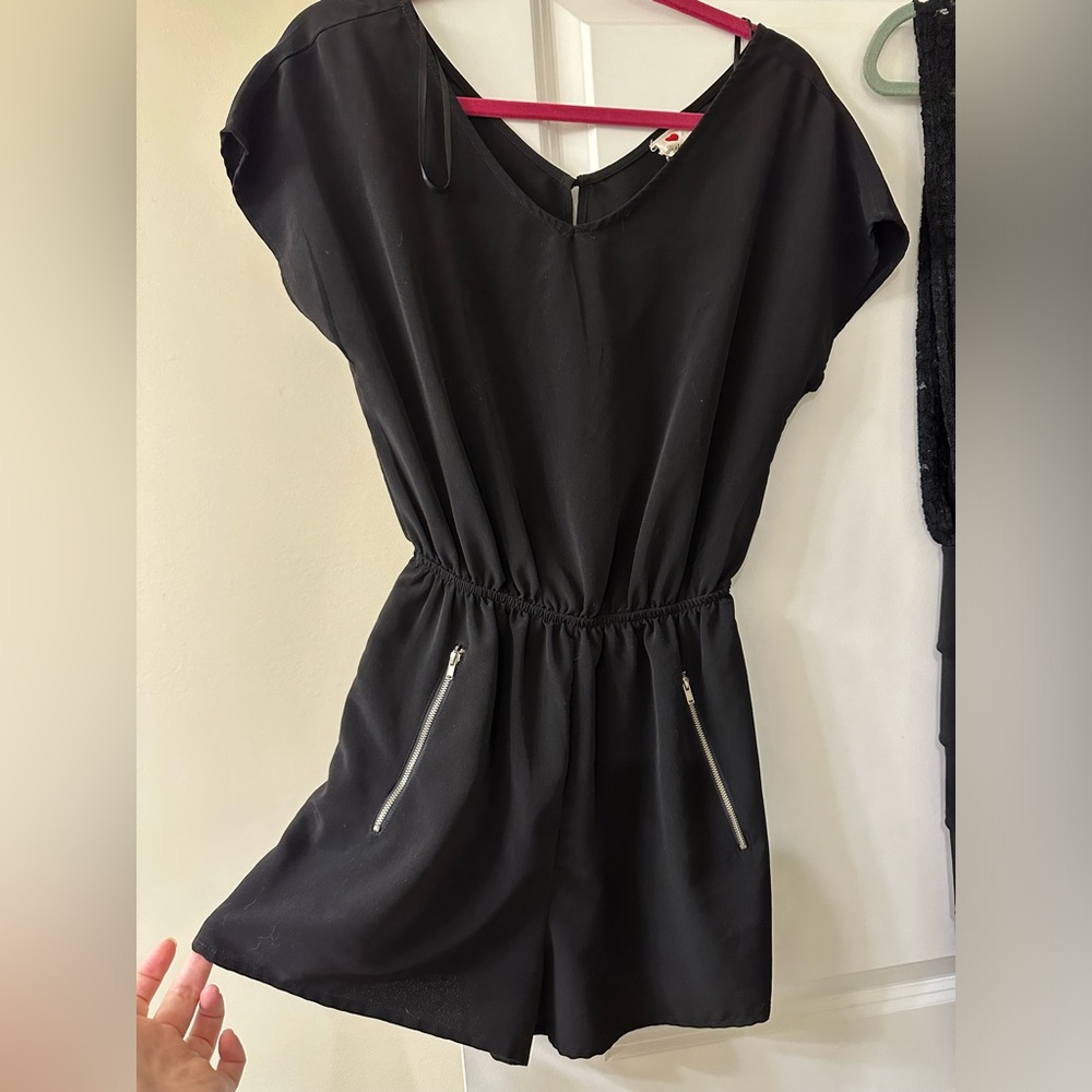 Black Romper with Zipper Detailing. Size medium.